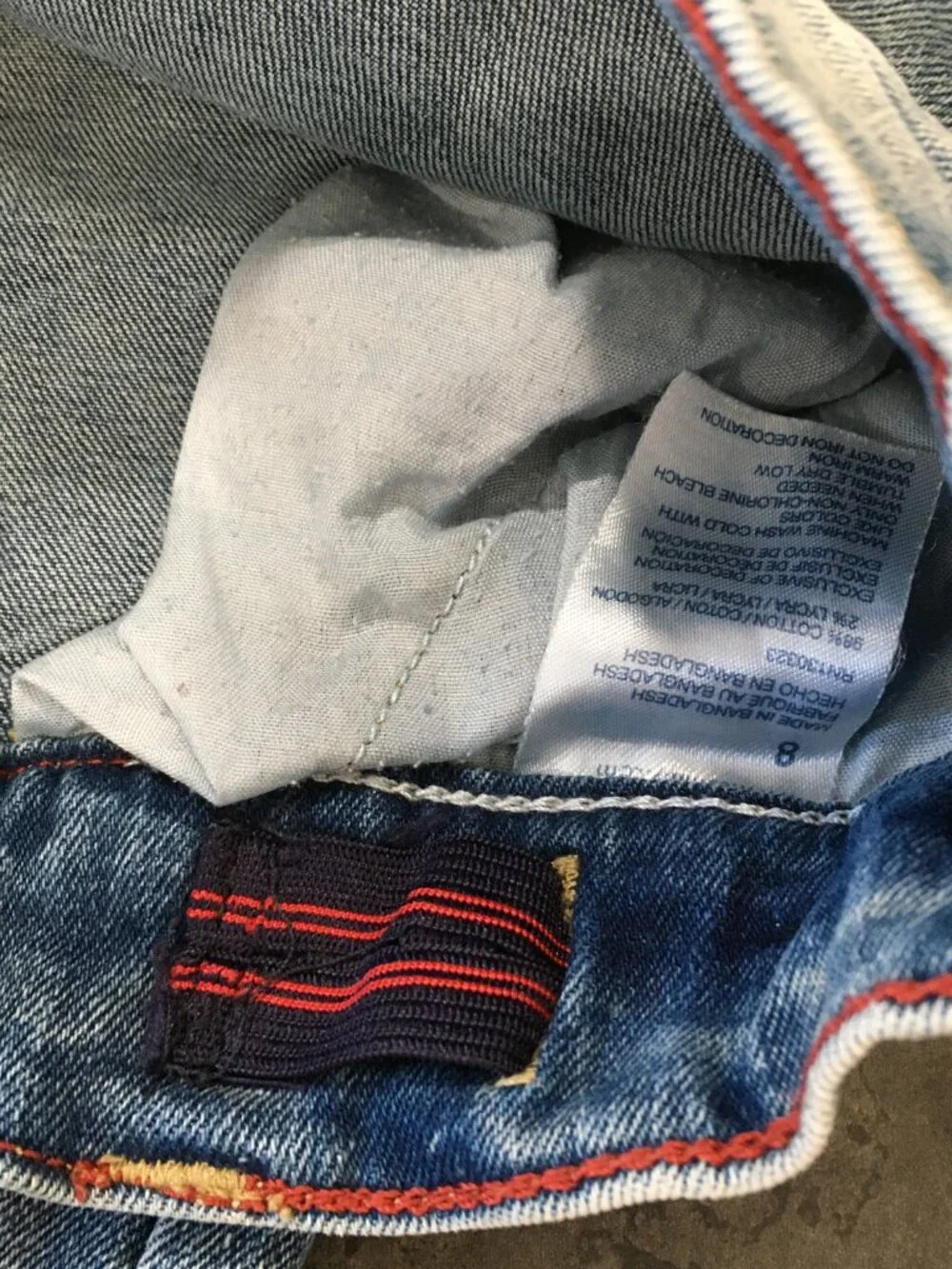 TOMMY HILFIGER Distressed Cut Step Hem Adj Waist Distressed Applique Logo Jeans